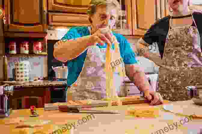 A Woman Cooking Pasta In A Traditional Italian Kitchen. Seasons In Basilicata: A Year In A Southern Italian Hill Village