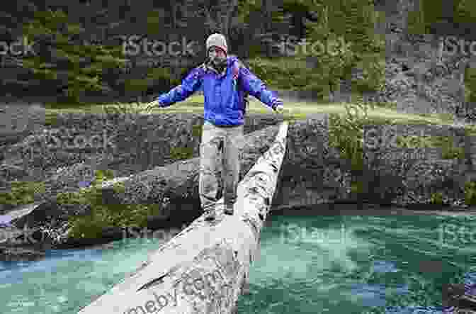 Adventurous Hiker Crossing A Swirling River, Surrounded By Dense Alaskan Wilderness. Retiring Wild: The Alaska Off Grid Survival