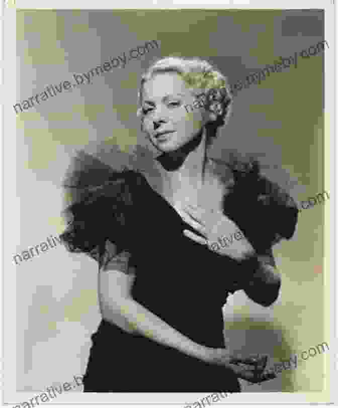 Cora Witherspoon Performing On Stage In A Glamorous Gown, Captivating The Audience With Her Expressive Gestures And Radiant Smile. Cora Witherspoon: A Life On Stage And Screen