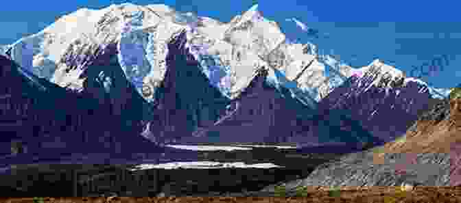 Panoramic View Of Towering Mountains In Alaska, Snow Capped Peaks Piercing The Heavens. Retiring Wild: The Alaska Off Grid Survival